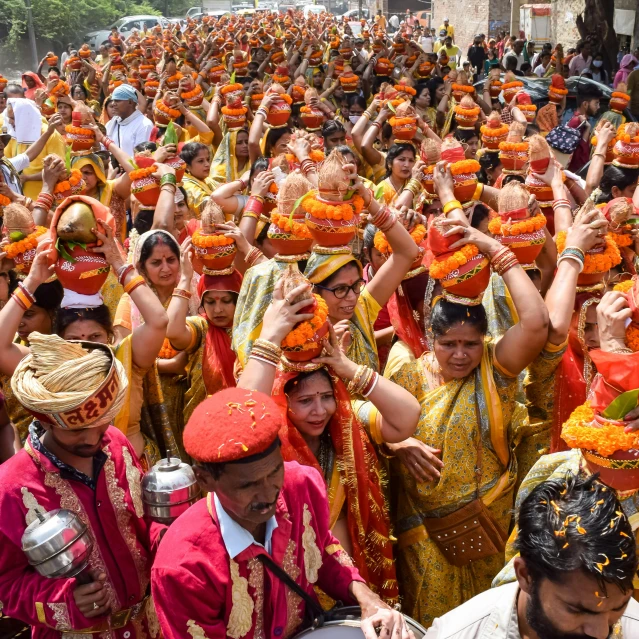 a large group of people dressed in indian costumes