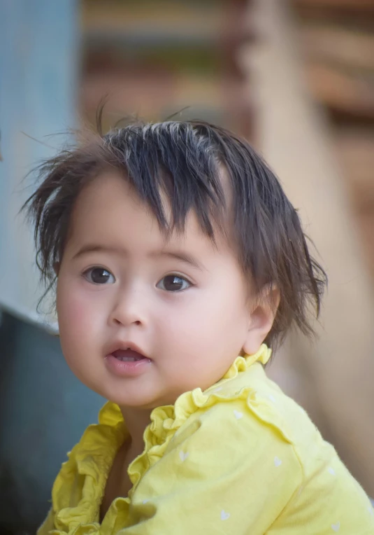 an image of a little girl sitting down