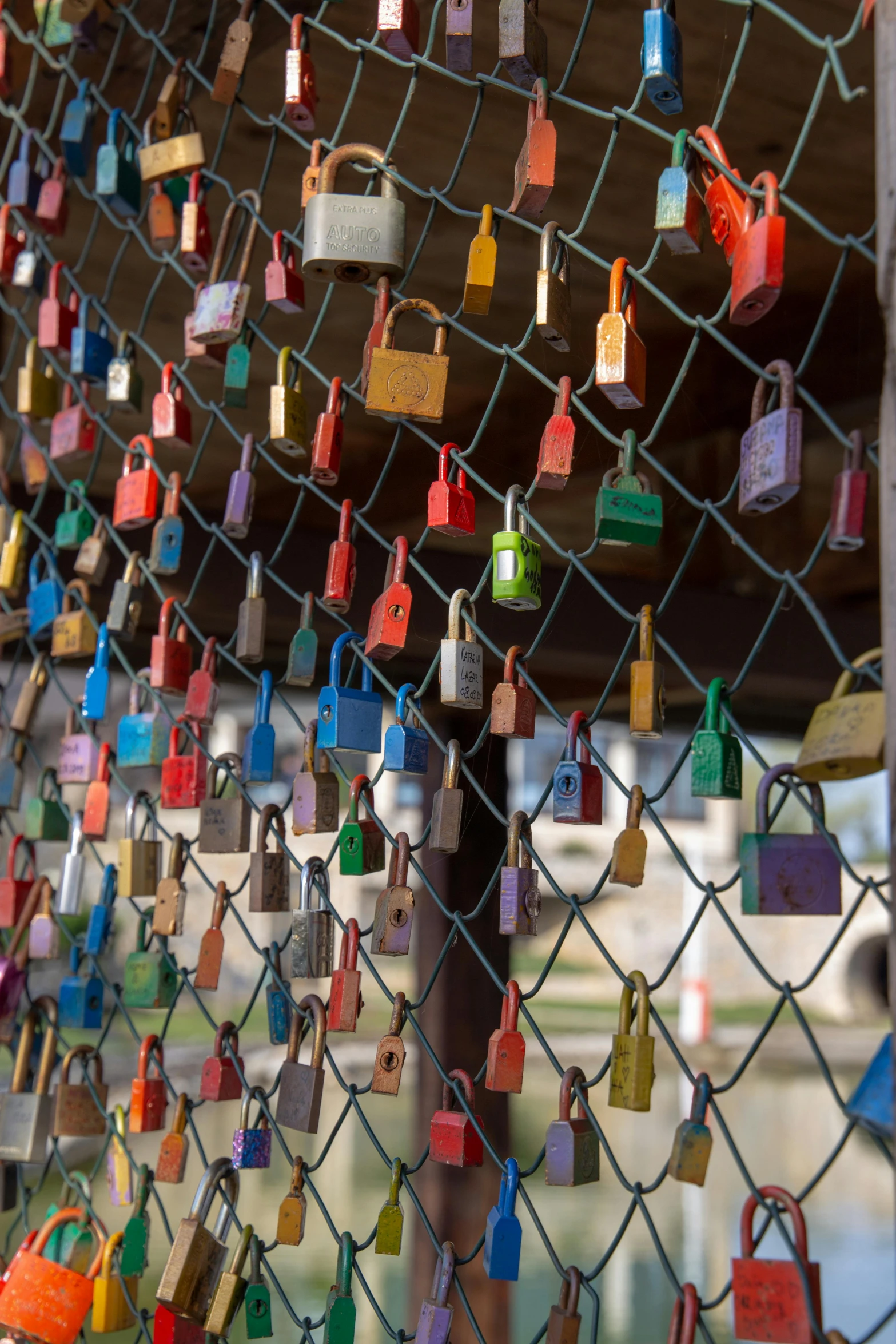 many locks are attached to the fence and hung on them