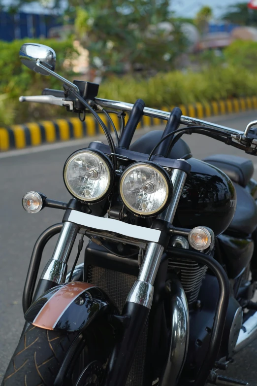 the headlight and lightbars of a black motorcycle