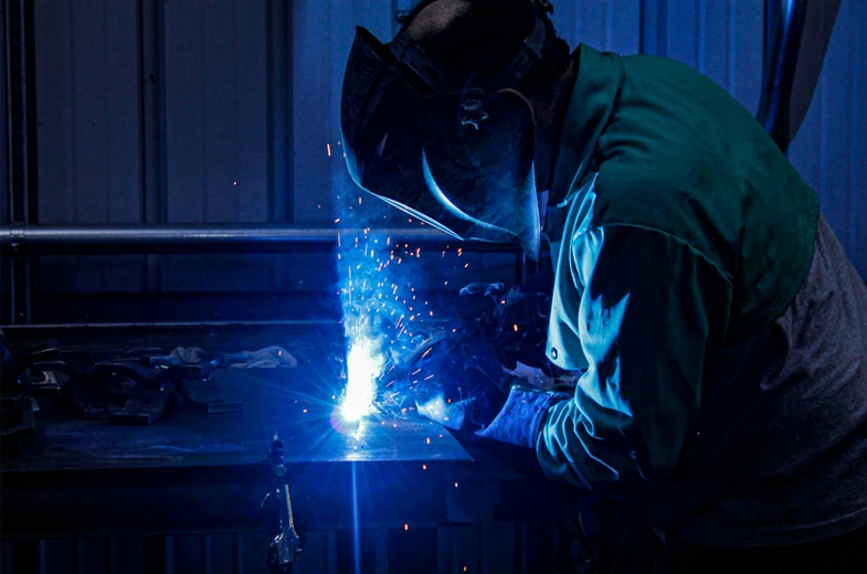 a man working with a welding machine