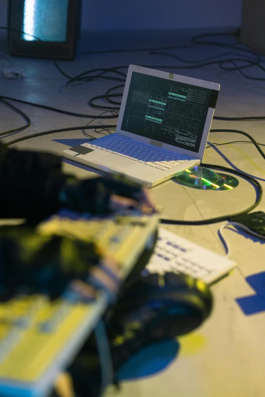 a laptop with some software on it laying on a desk