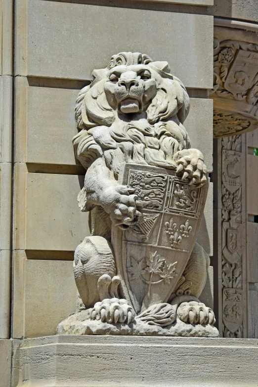 a stone lion statue is on display in front of an elaborate doorway