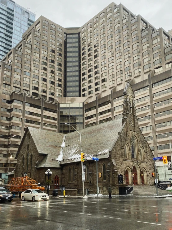 a church next to buildings in a city