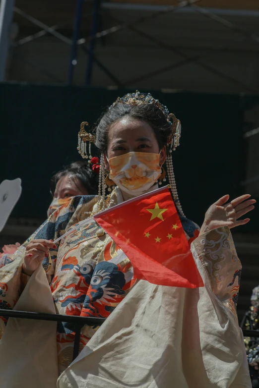 three women in dress with masks on their faces