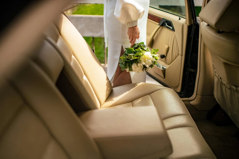 the bride stepping off her car onto the field