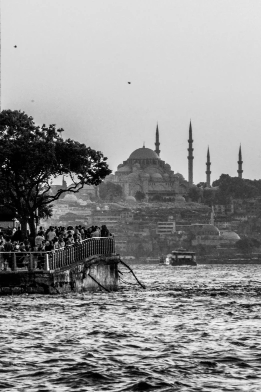 a crowd of people on a boat watching soing