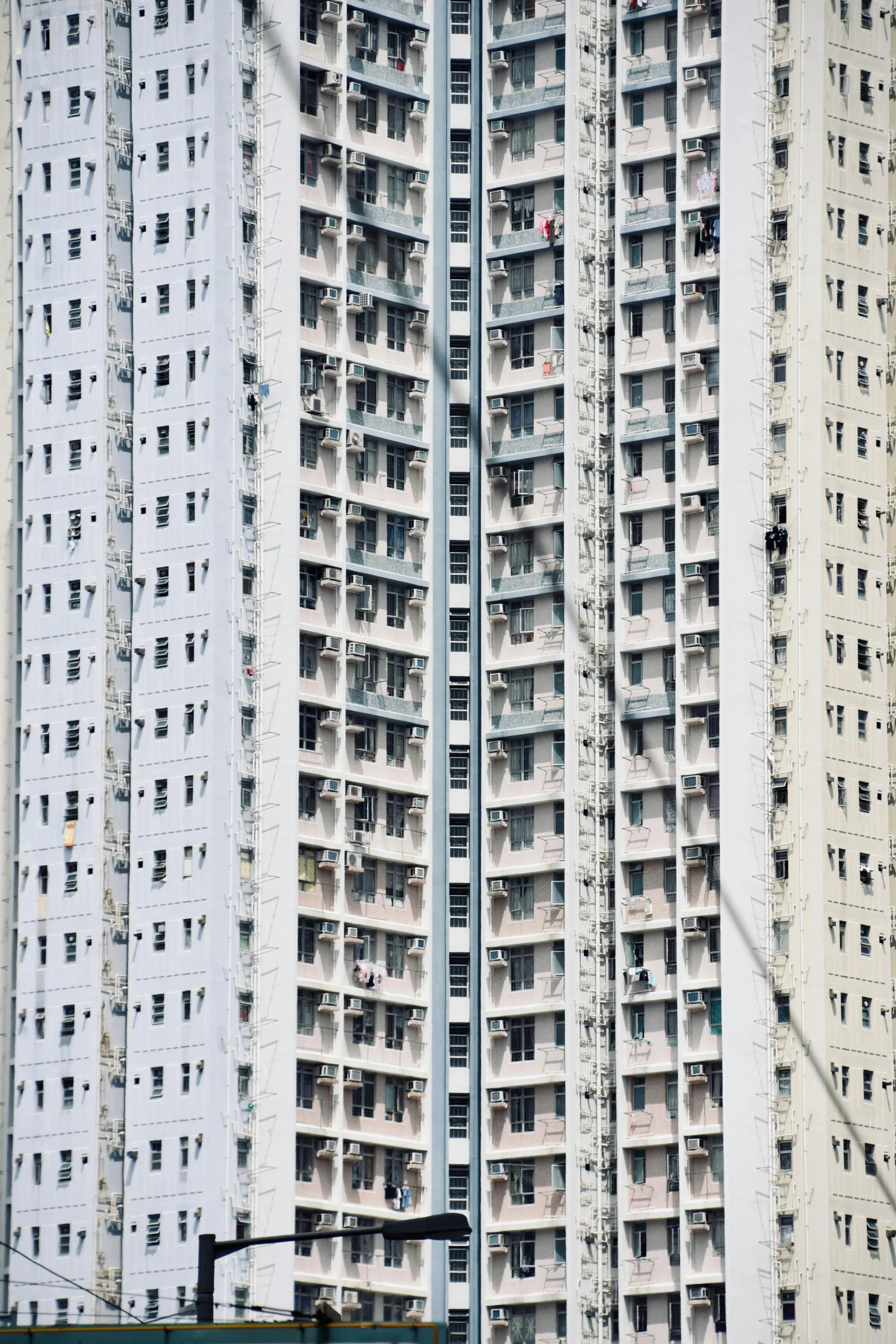 a picture of tall buildings and a red traffic light