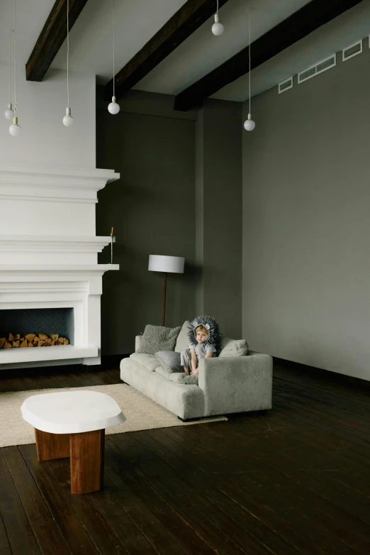 a room with a fireplace and a white couch