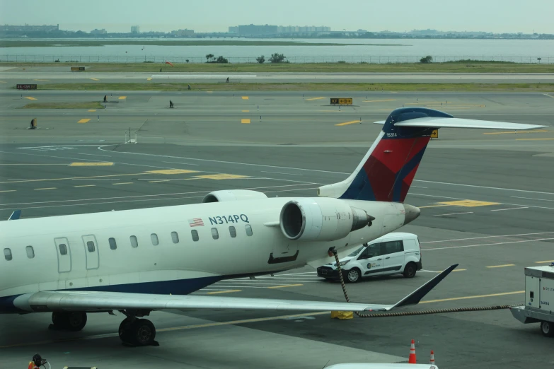 a large jetliner sitting on top of an airport tarmac