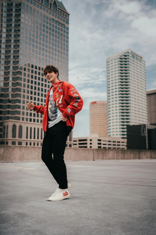 young man in colorful jacket doing skateboard trick