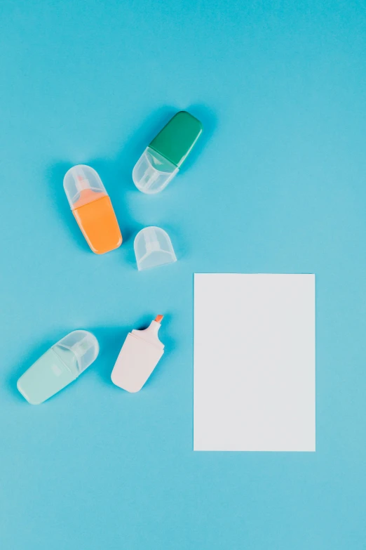 the small pill holders are set next to a card