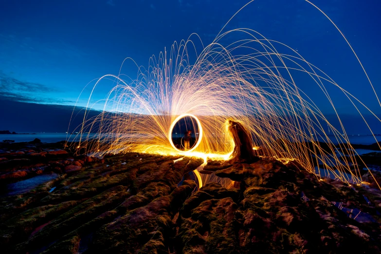 two circular objects are in motion while people watch