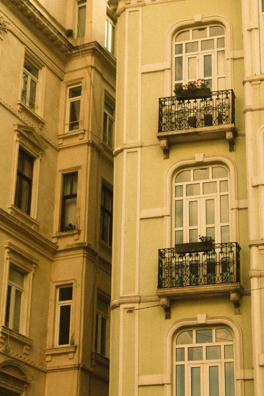 two balconies are on this building in an old city