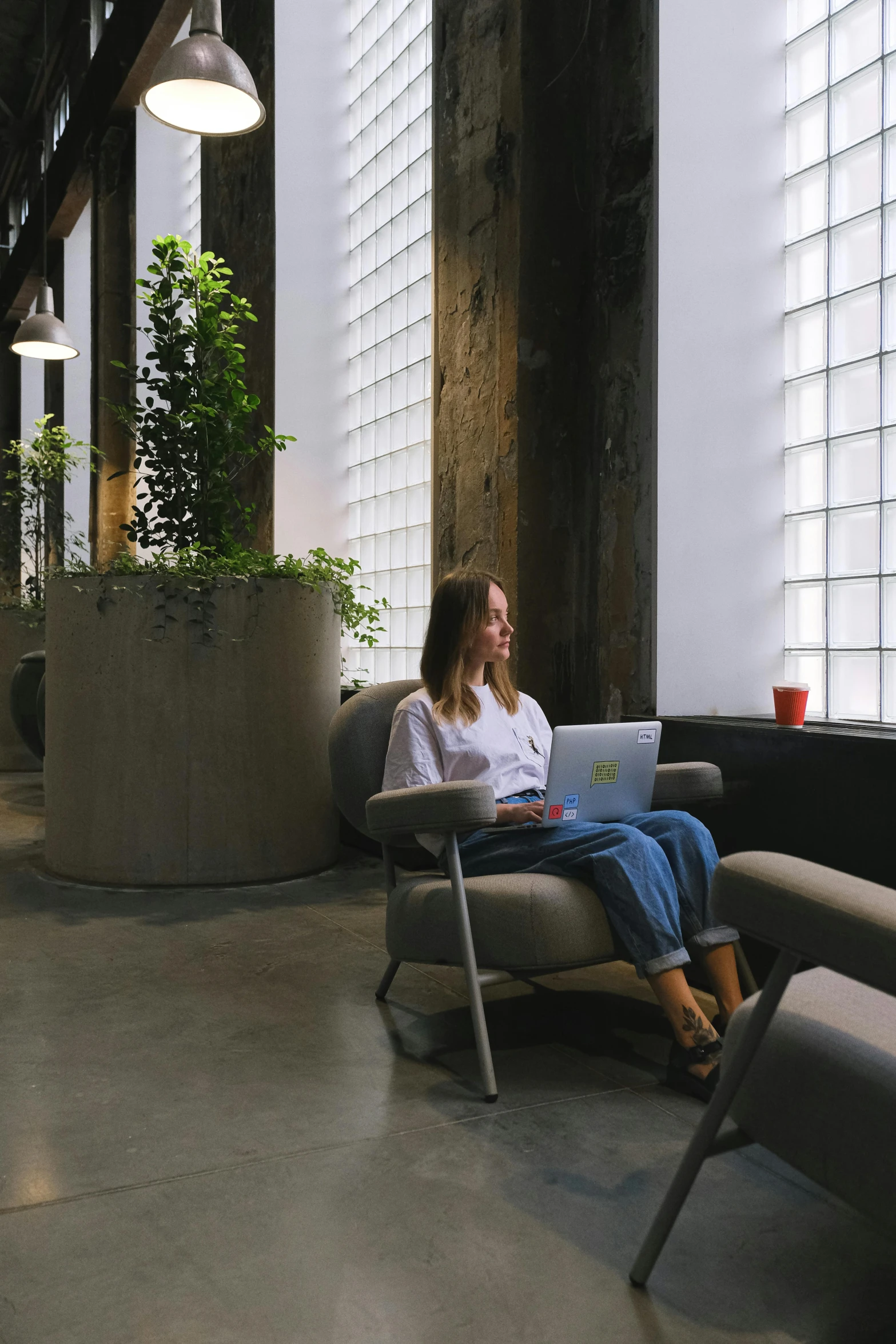 a woman is on her computer in an office setting