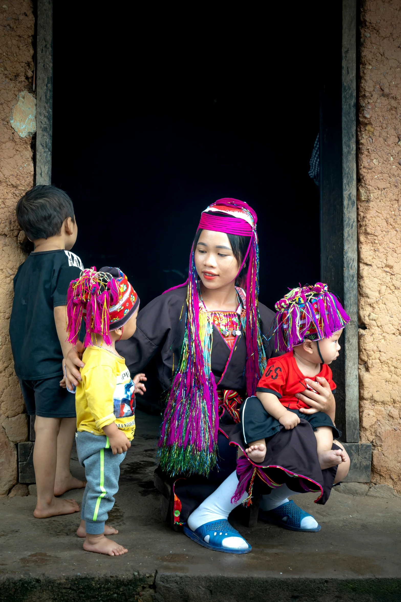 two children and one is dressed in an ethnic dress