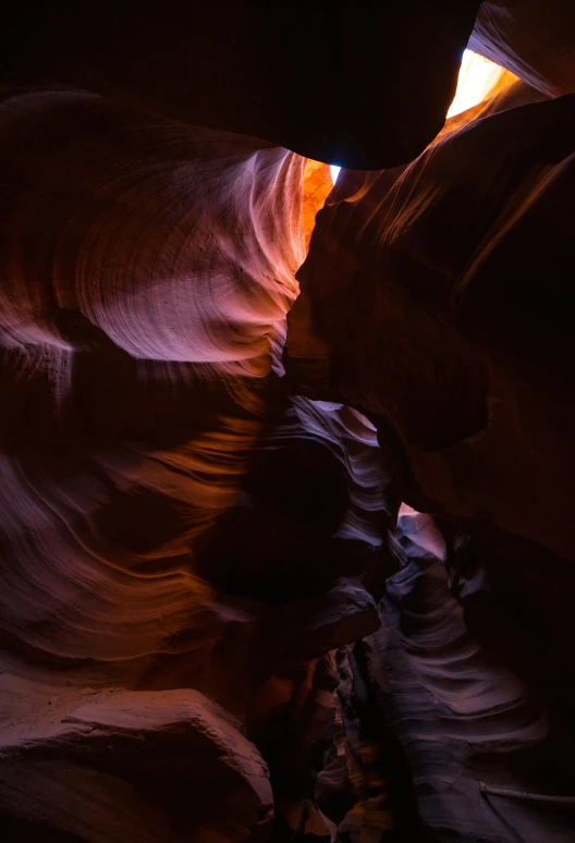 the light is coming through a canyon entrance