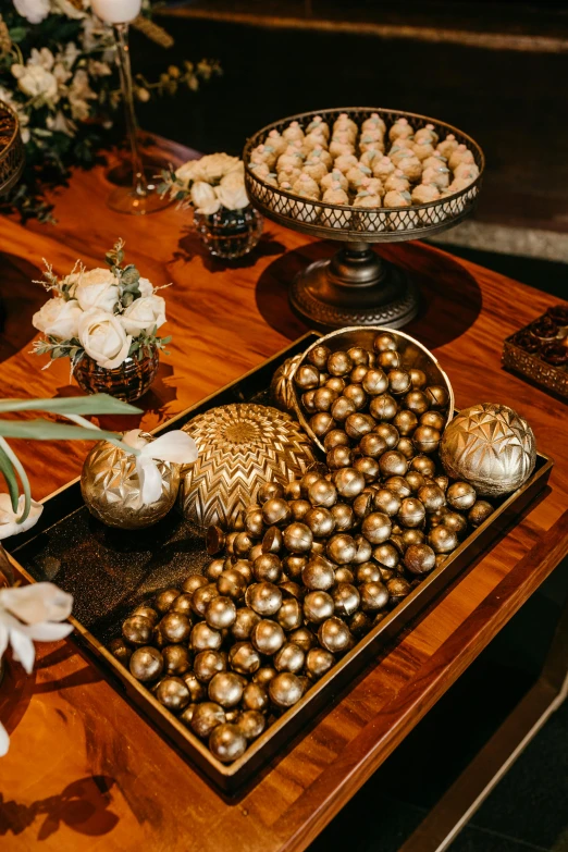 a table topped with brown and white candies