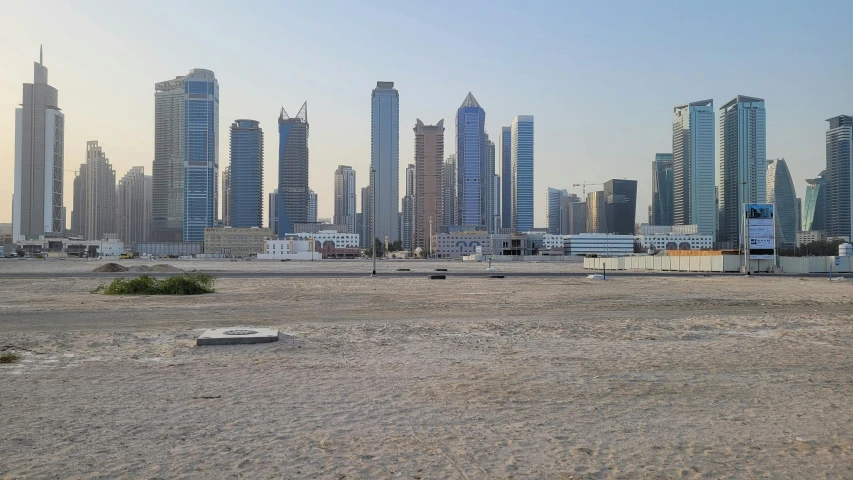 a large city of tall buildings and sand