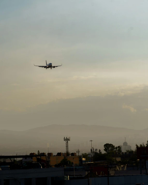 a jet flying by in a hazy sky