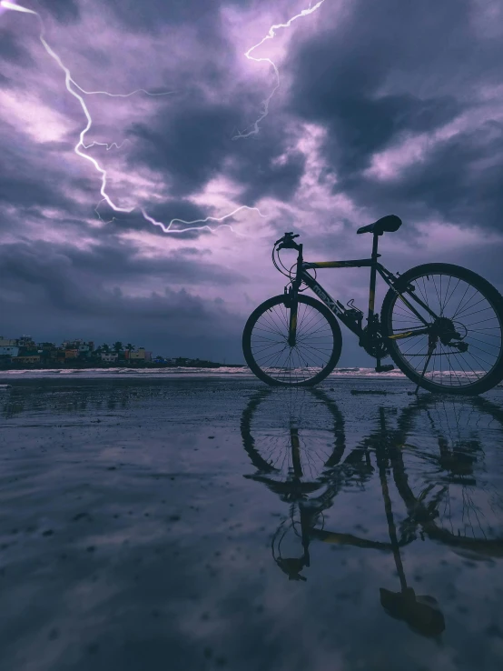 a bike standing in the middle of the water with a lightning bolt