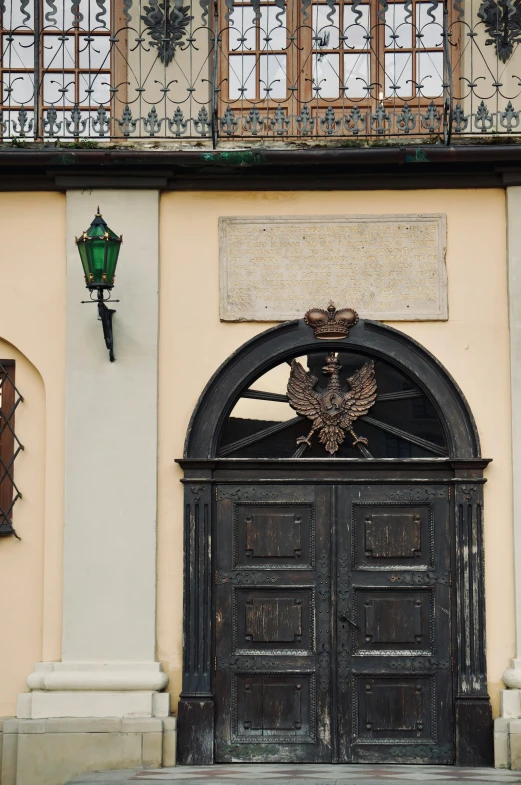 the front door to the house with decorative ornaments