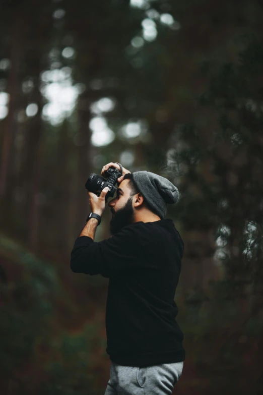 a man taking a picture with a camera