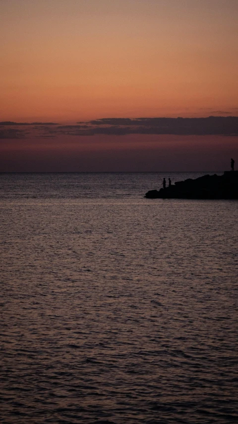 an island sits at the end of a large body of water