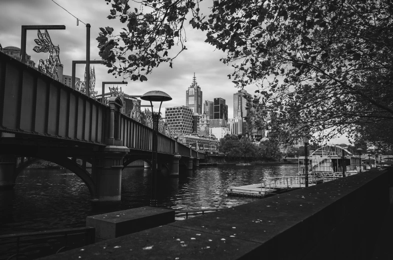 a bridge in the distance is across the water