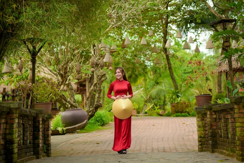 a woman holding a large yellow object in her hand