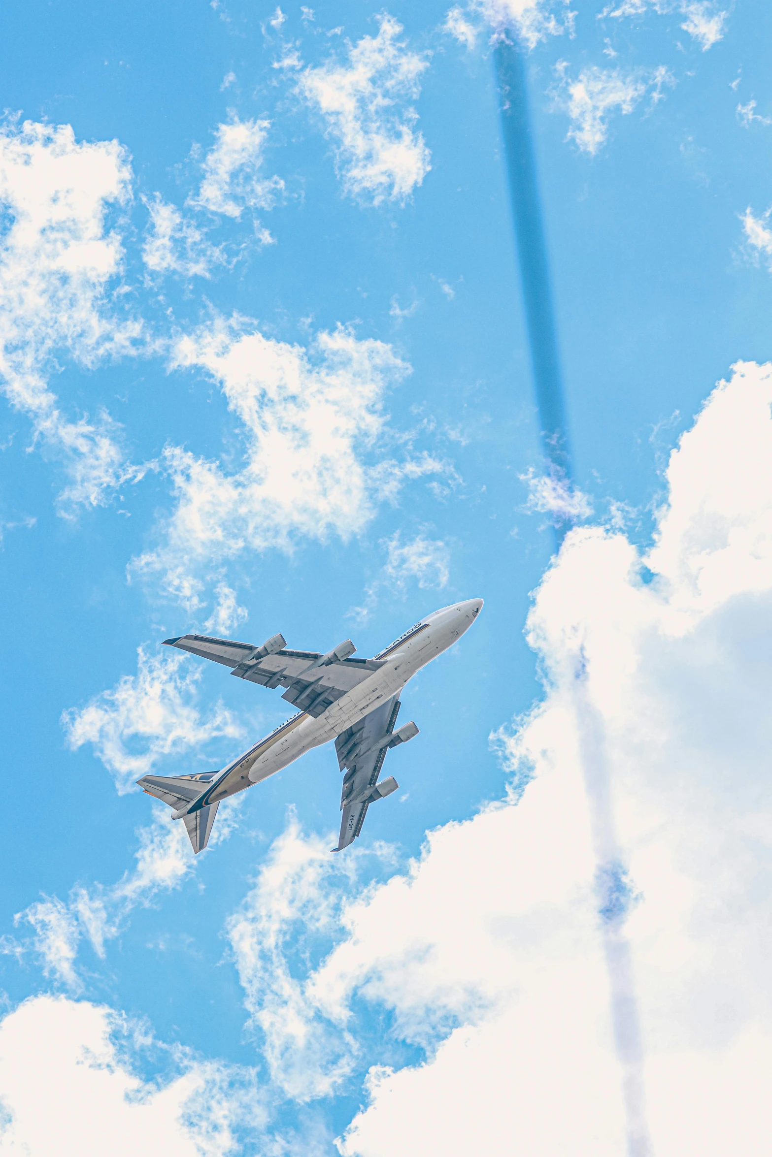 an airplane is flying through the blue sky