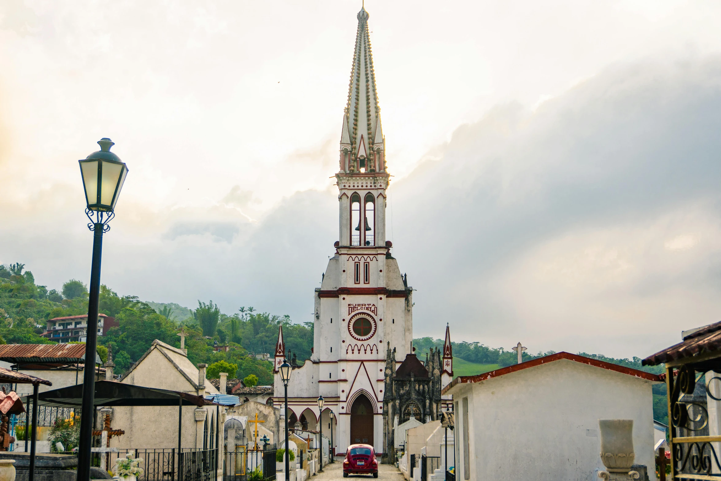 a street with a clock tower next to buildings