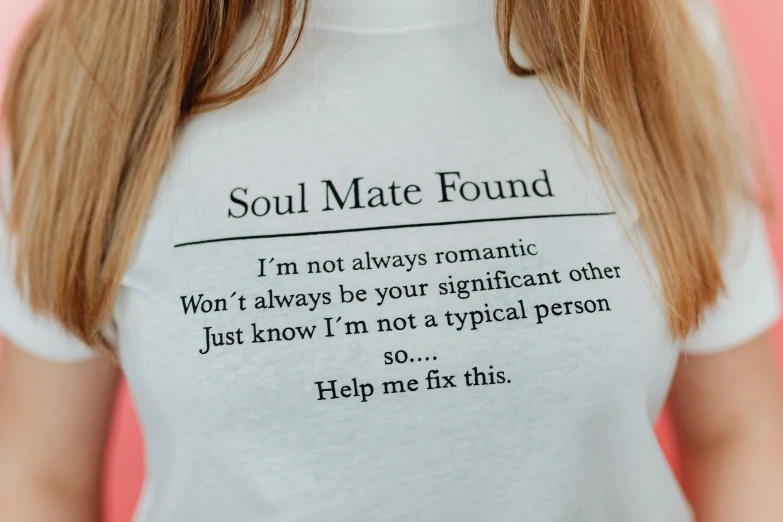 a woman wearing a tee shirt that says, soul mate found