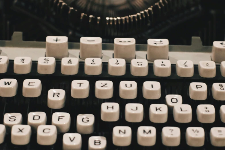 an antique typewriter with the keys and numbers missing