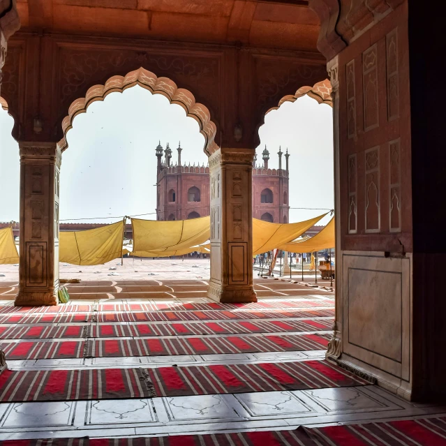 the inside of an ornate building with arches