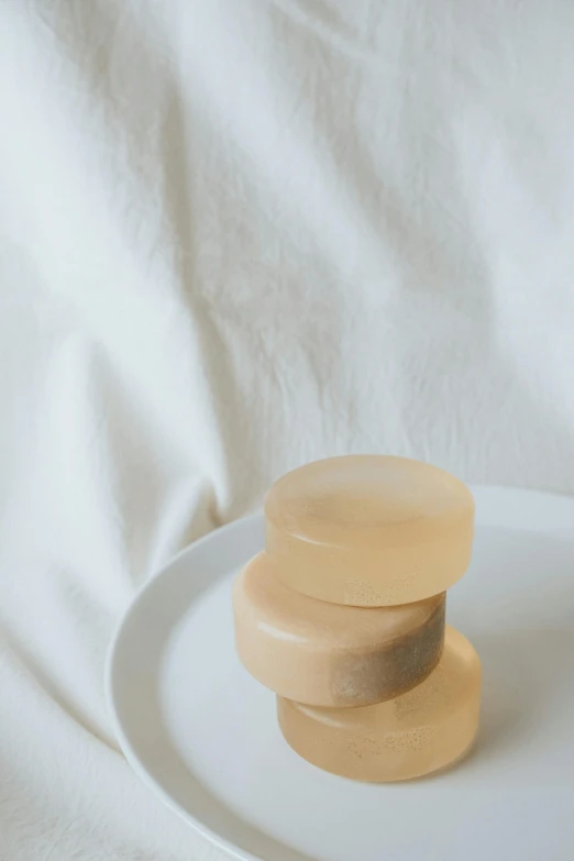 a set of wooden discs on top of a white plate