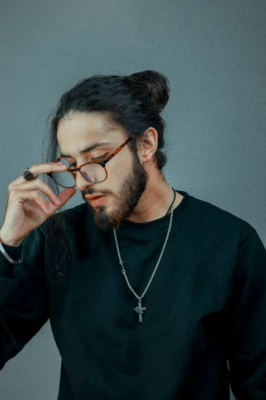 a man with glasses and long hair with a beard