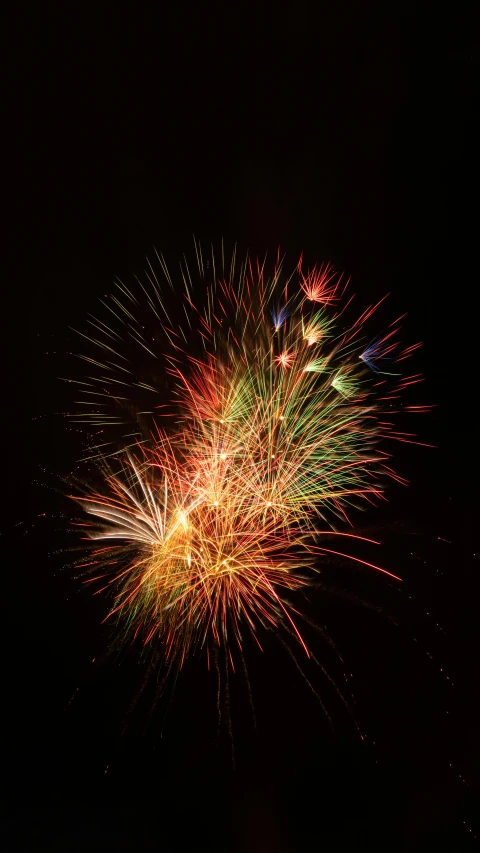 fireworks being lit by various colorful lights in the sky