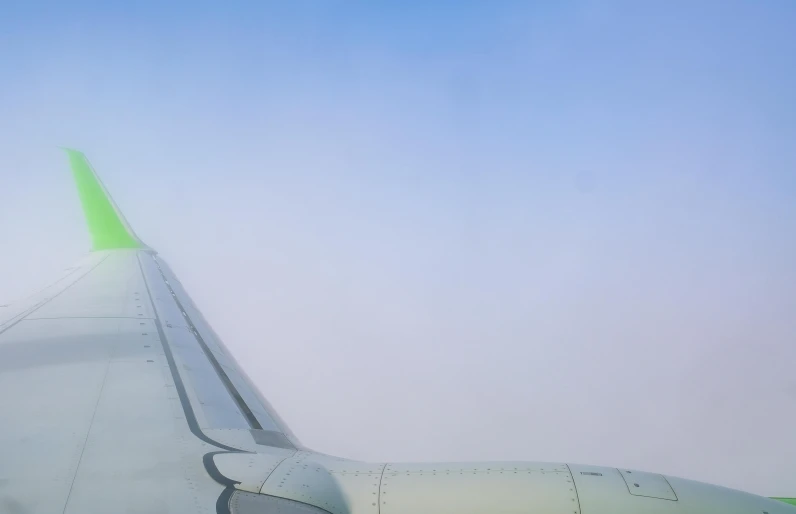 there is a view from an airplane of the wing