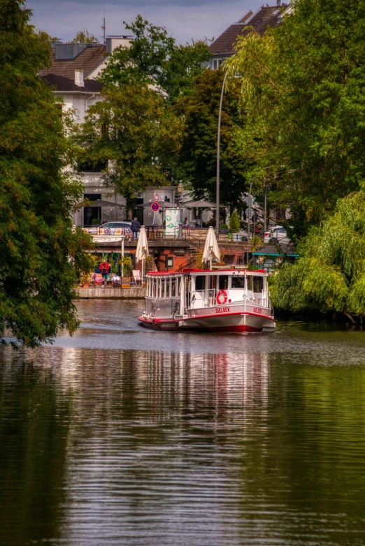 there is a boat floating down the river