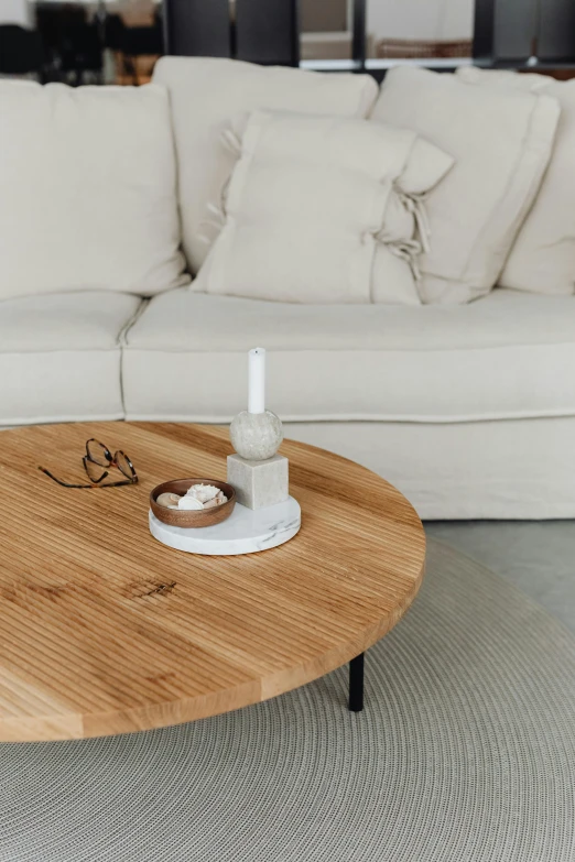 a coffee table with candles on it in the living room