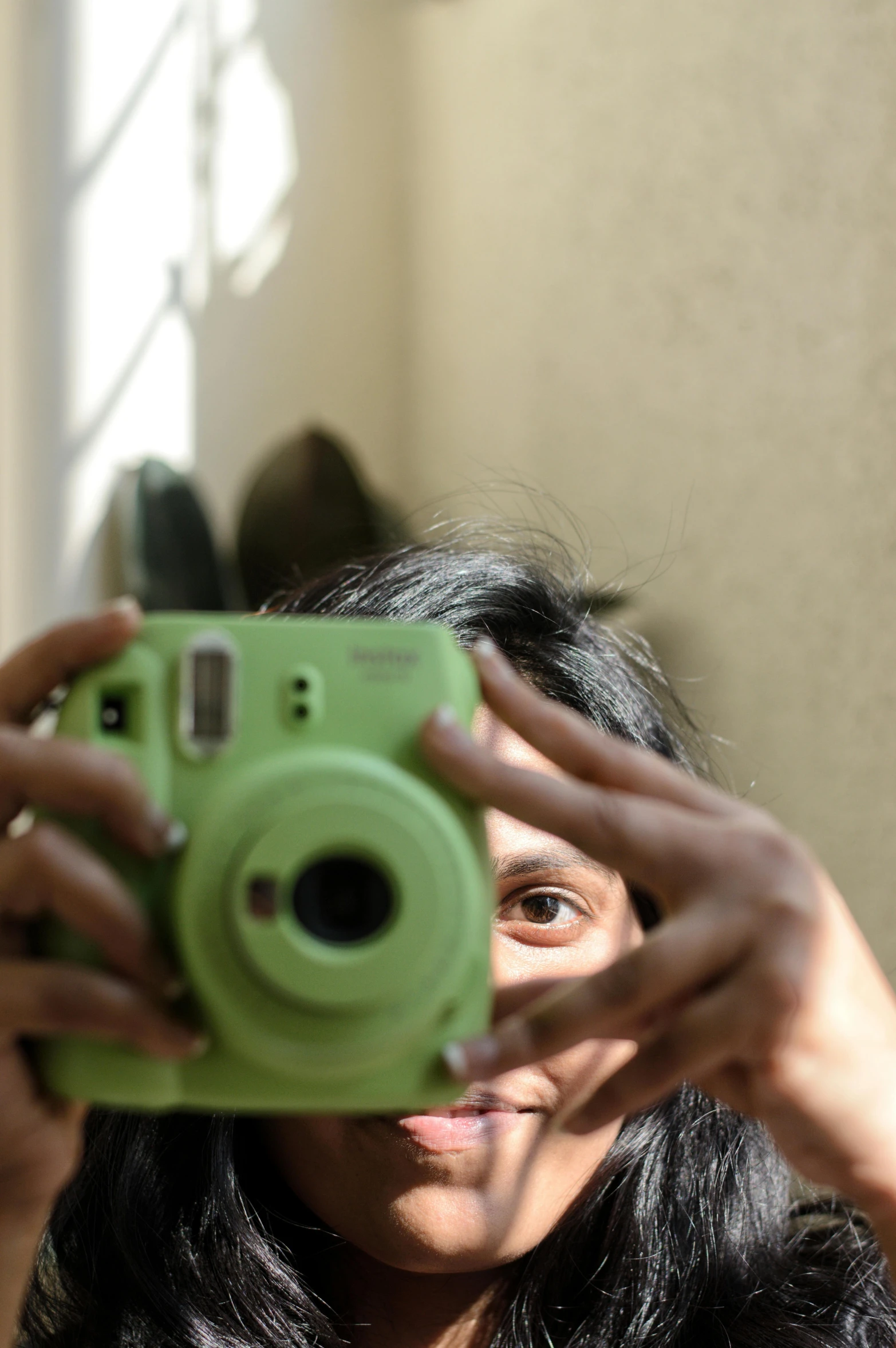 a woman is taking a selfie in front of the mirror