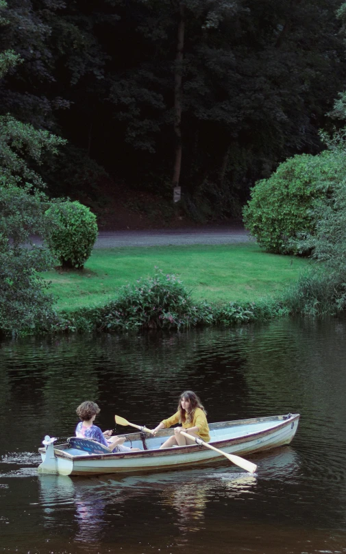 two women in a row boat on the river