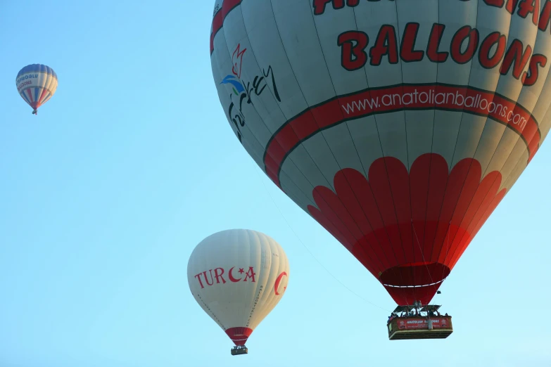 two  air balloons flying in the blue sky