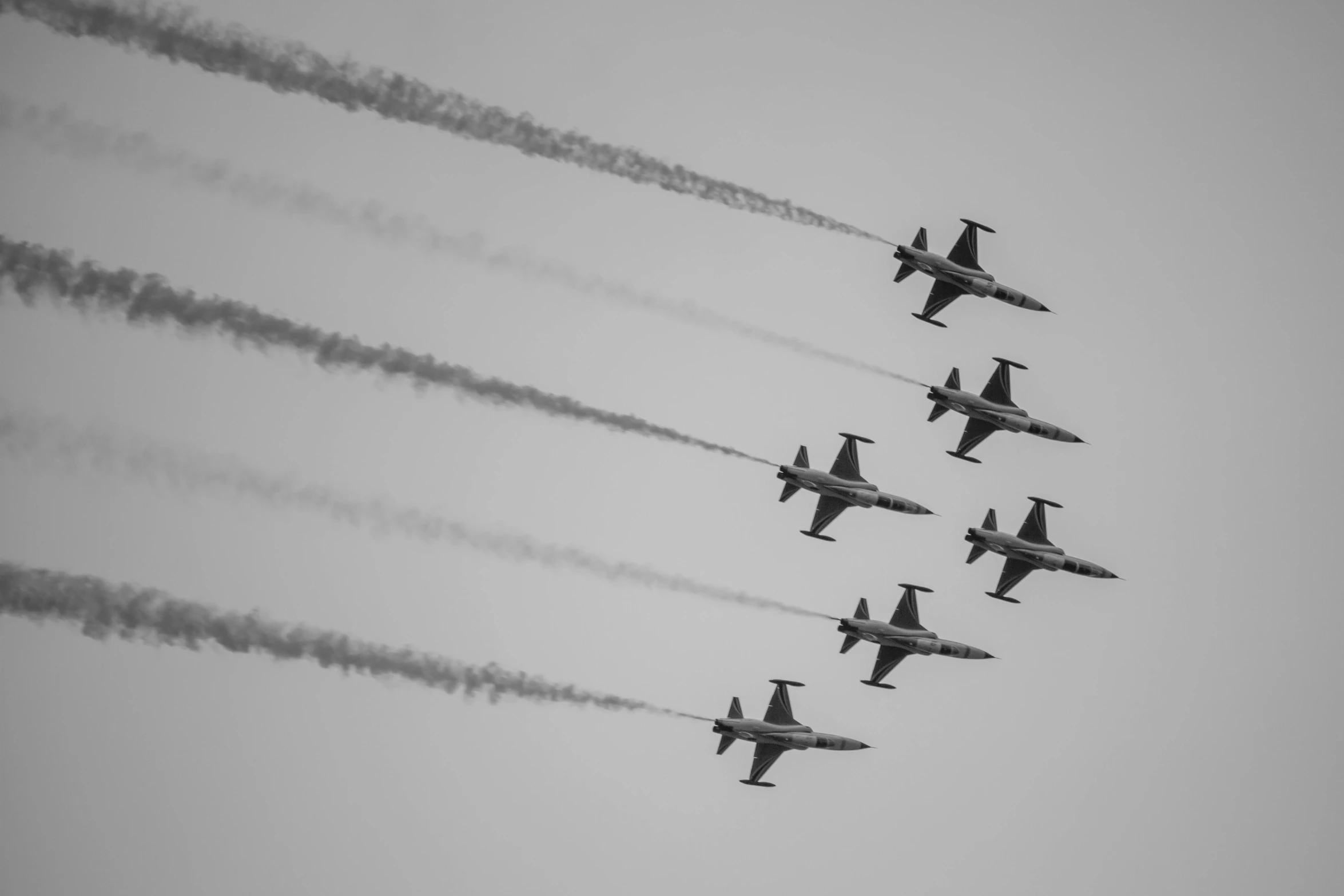 a formation of fighter jets flying in the sky