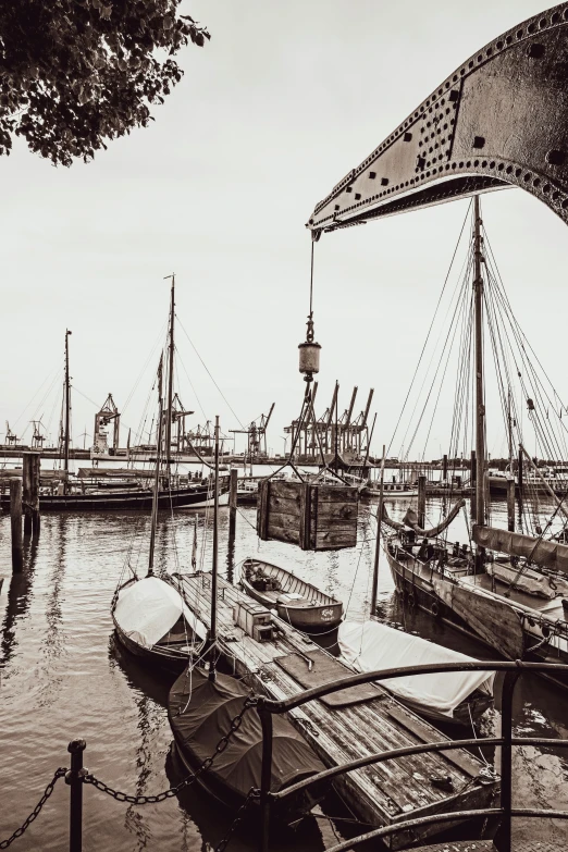 several ships docked at dock with one sail boat