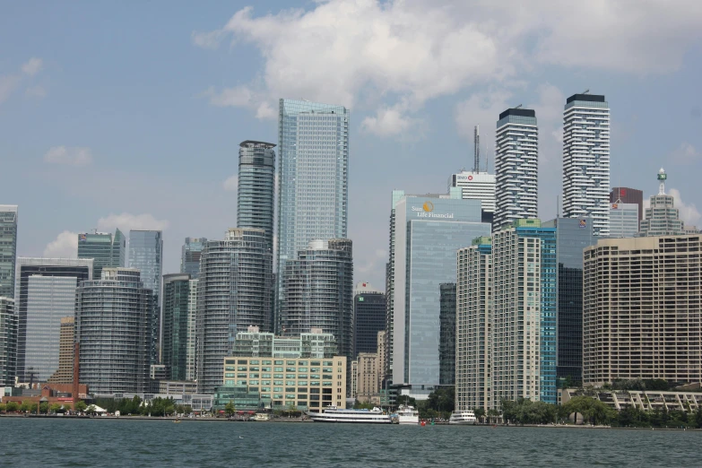 a city is shown in the foreground of the water