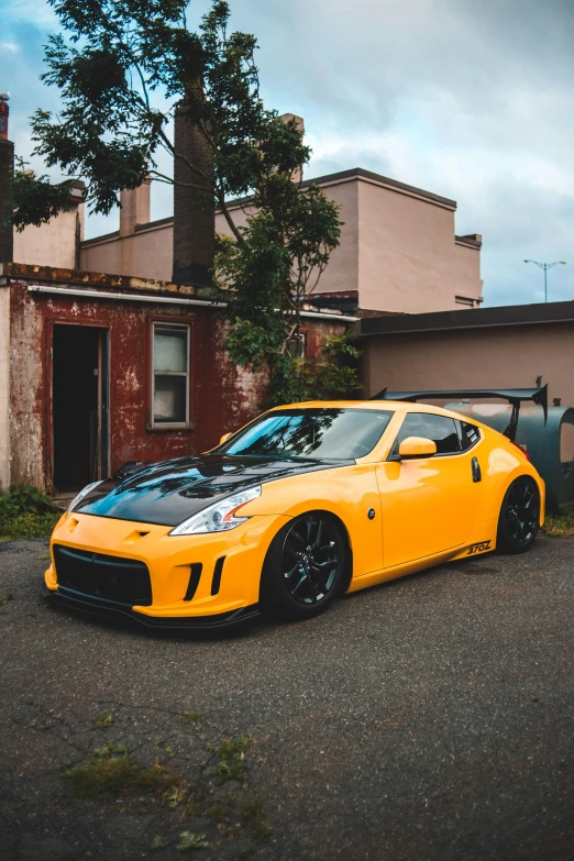 a yellow car is parked in front of a building