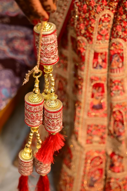 the details of different tassels hanging from the dress