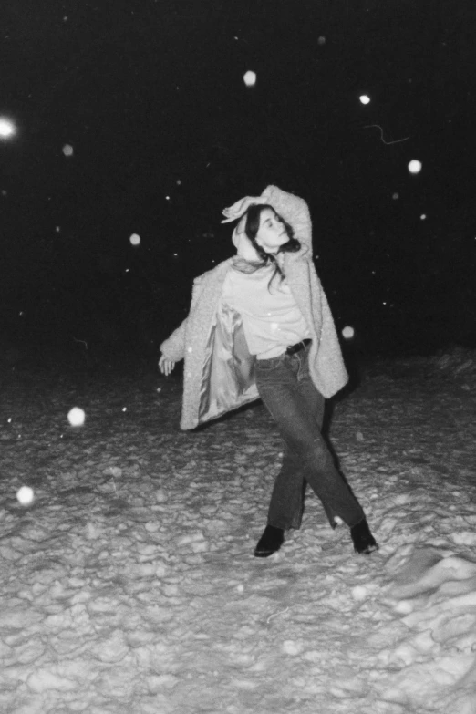 a woman walking in the snow outside